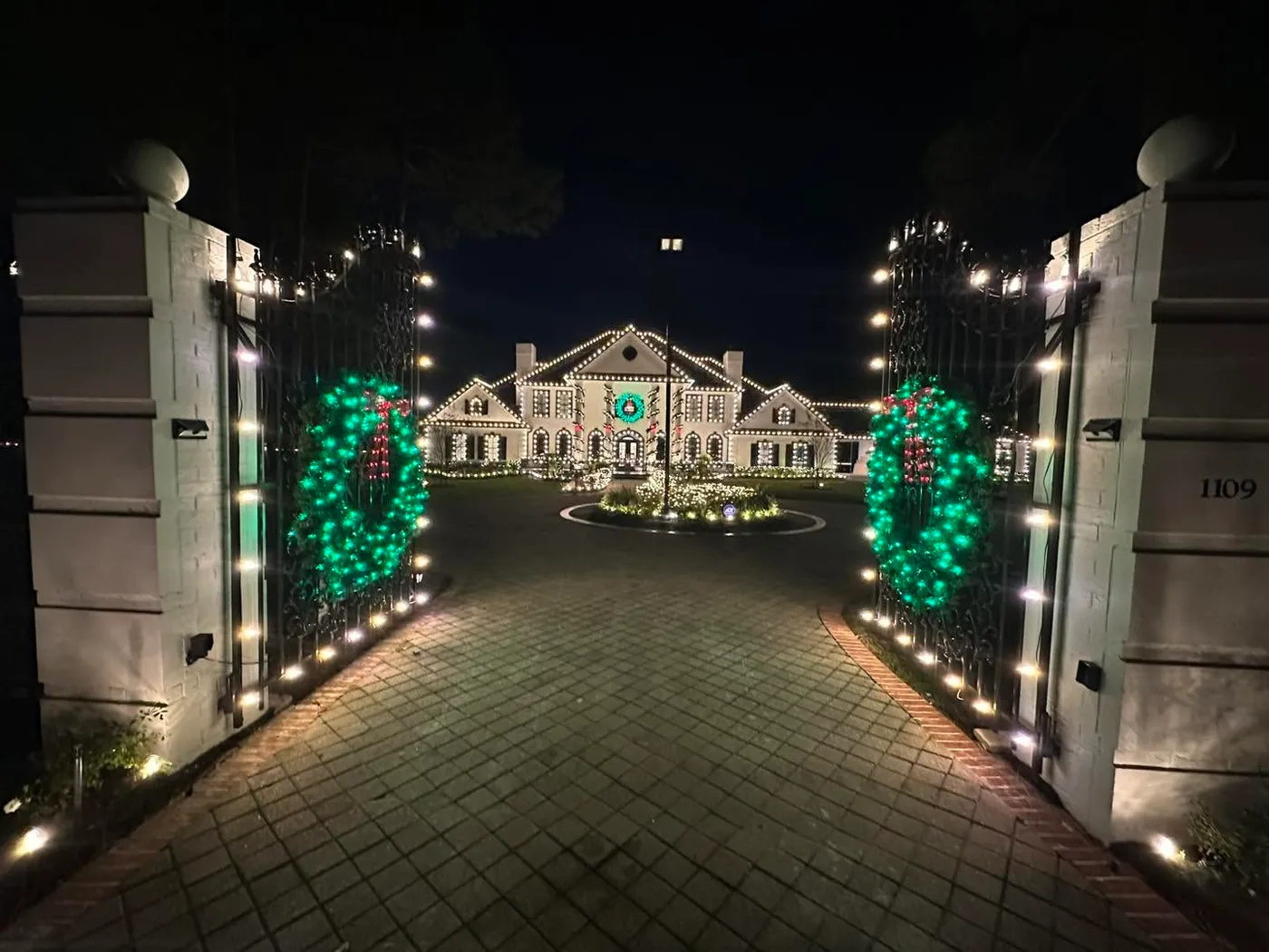 Palatial estate during Christmas from the gate view